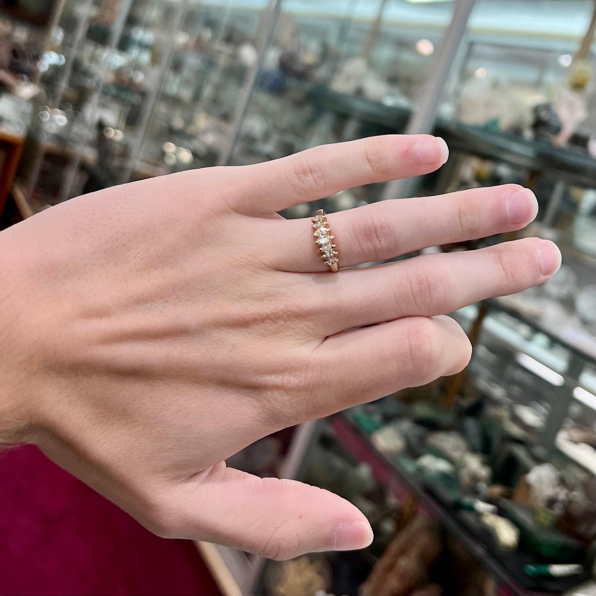 An estate yellow gold ring prong set with seven marquise cut diamonds.