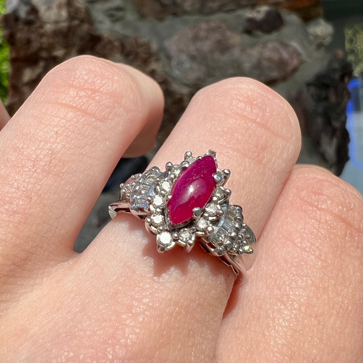 A vintage style white gold marquise cabochon cut ruby and diamond ring.