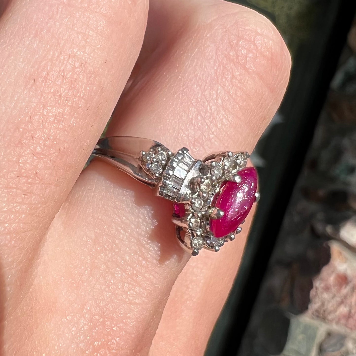 A vintage style white gold marquise cabochon cut ruby and diamond ring.