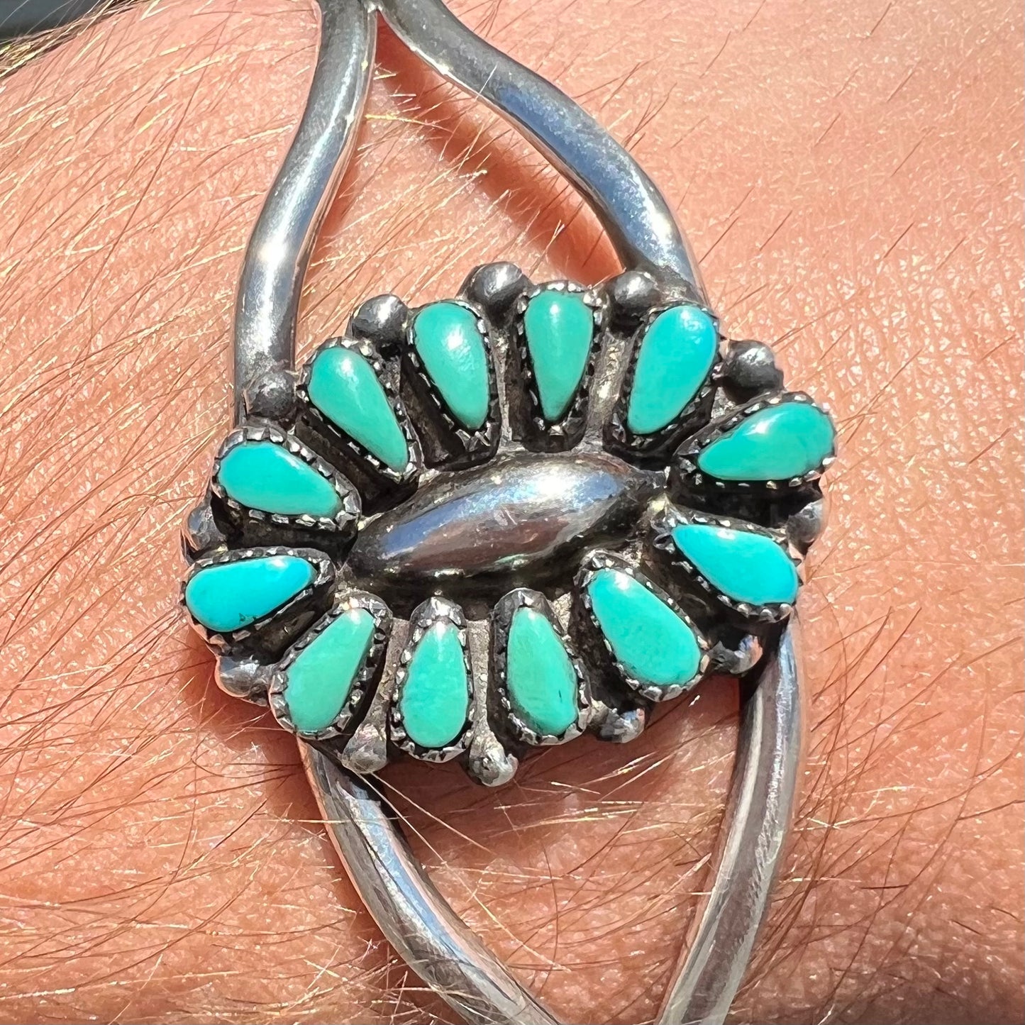 A Zuni style petit point silver turquoise cuff bracelet.  The piece was handmade and signed by Maryann and Felix Chavez.