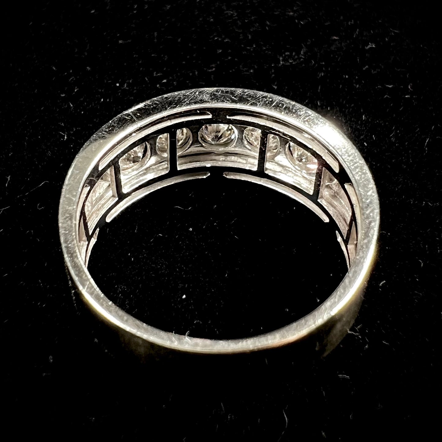 A men's estate white gold five stone diamond ring.