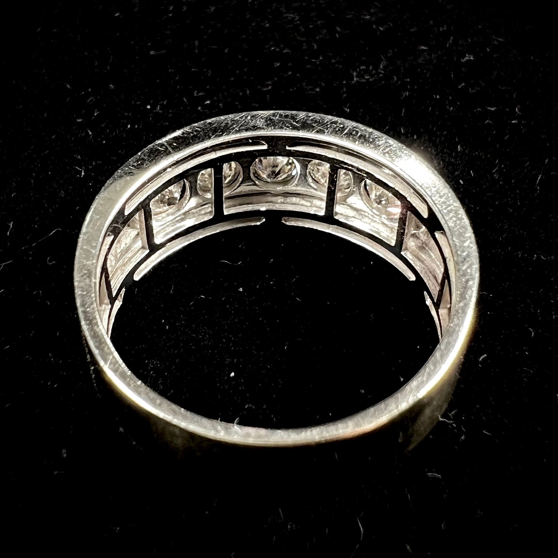 A men's estate white gold five stone diamond ring.