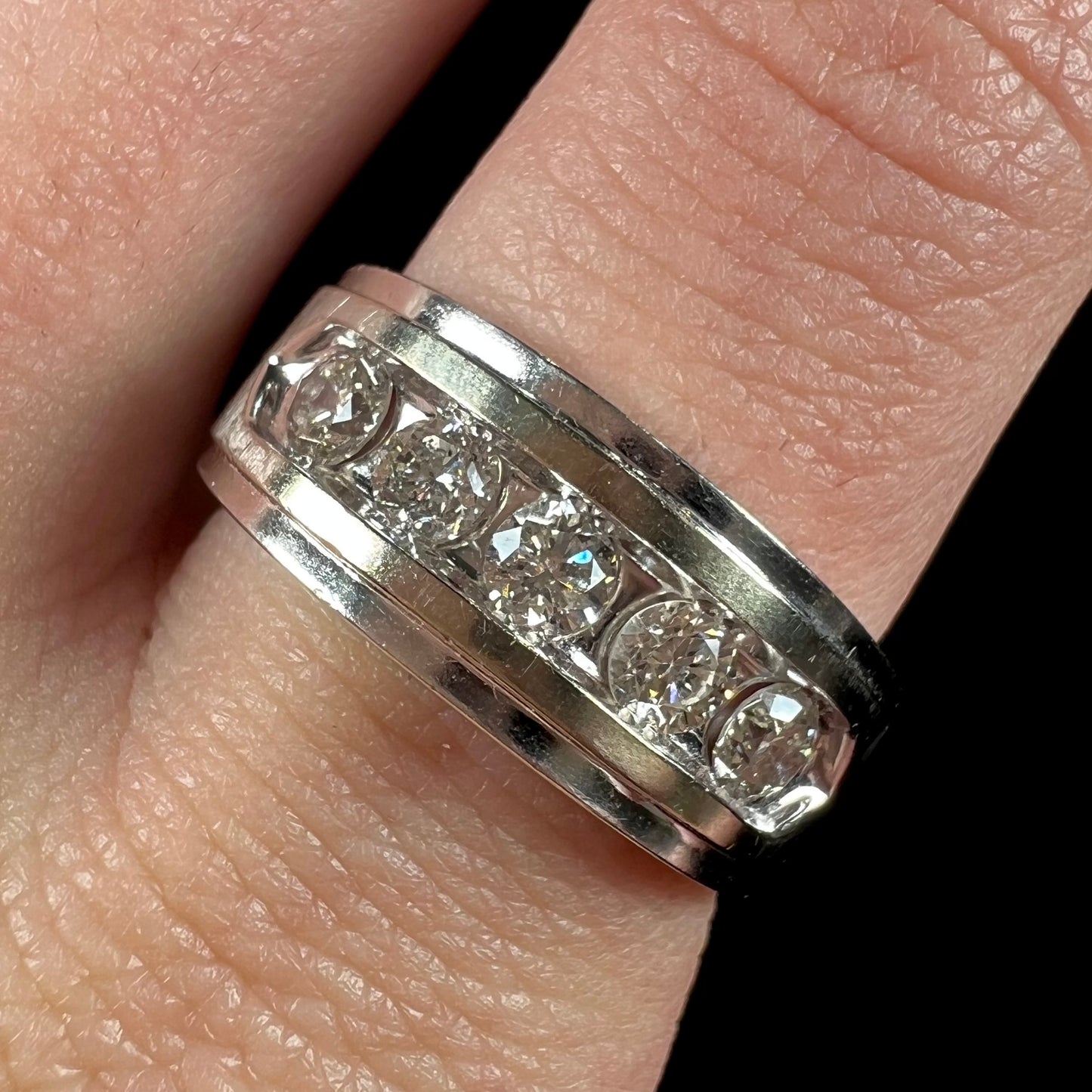 A men's estate white gold five stone diamond ring.