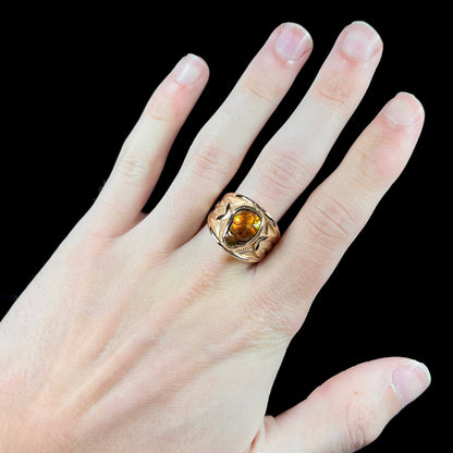 A men's 14kt yellow gold Mexican fire agate ring.