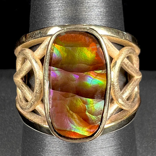 A men's yellow gold fire agate solitaire ring.  The fire agate is from Northern Mexico and has rainbow iridescence.