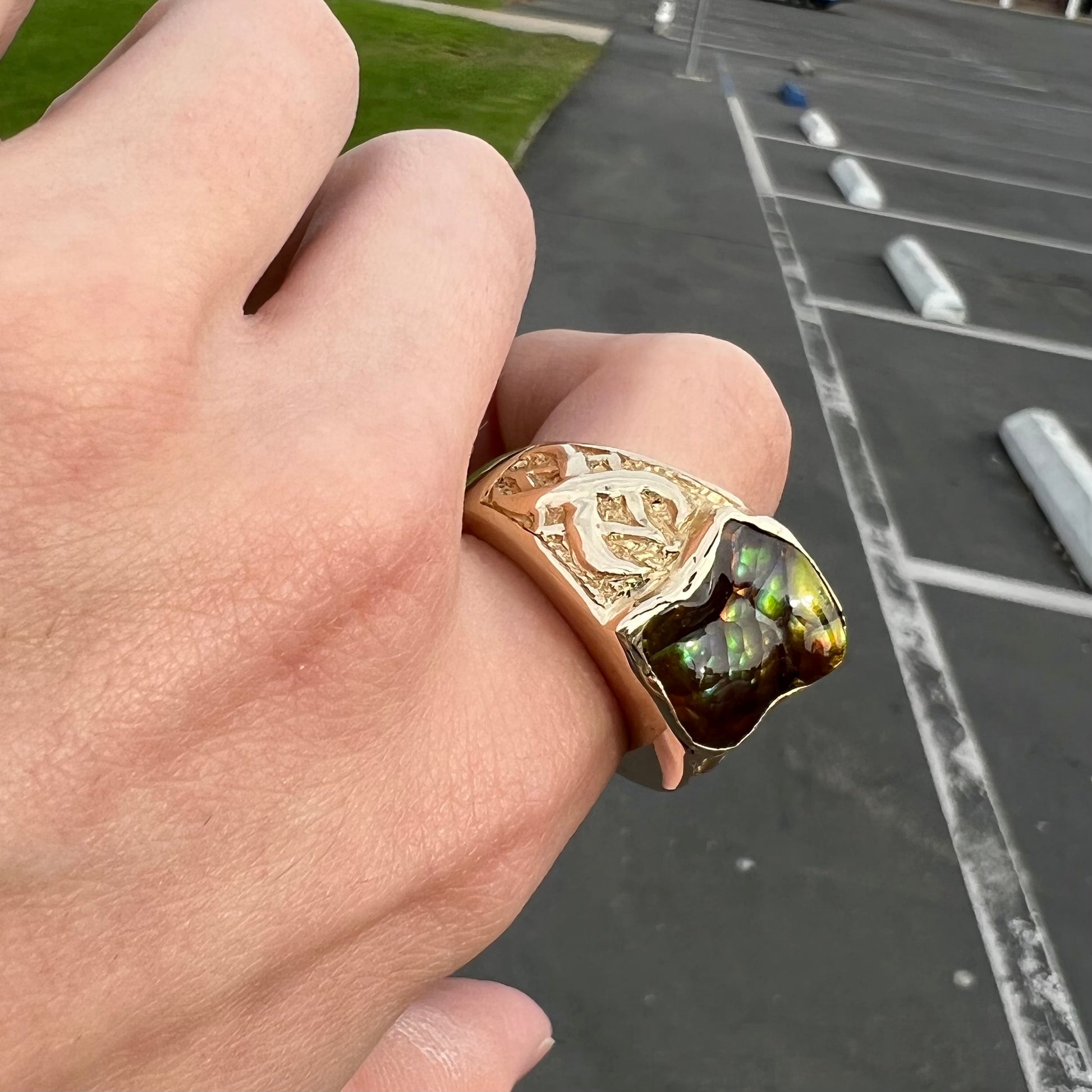 Custom, heavy yellow gold men's ring set with fire agate from Deer Creek, Arizona.