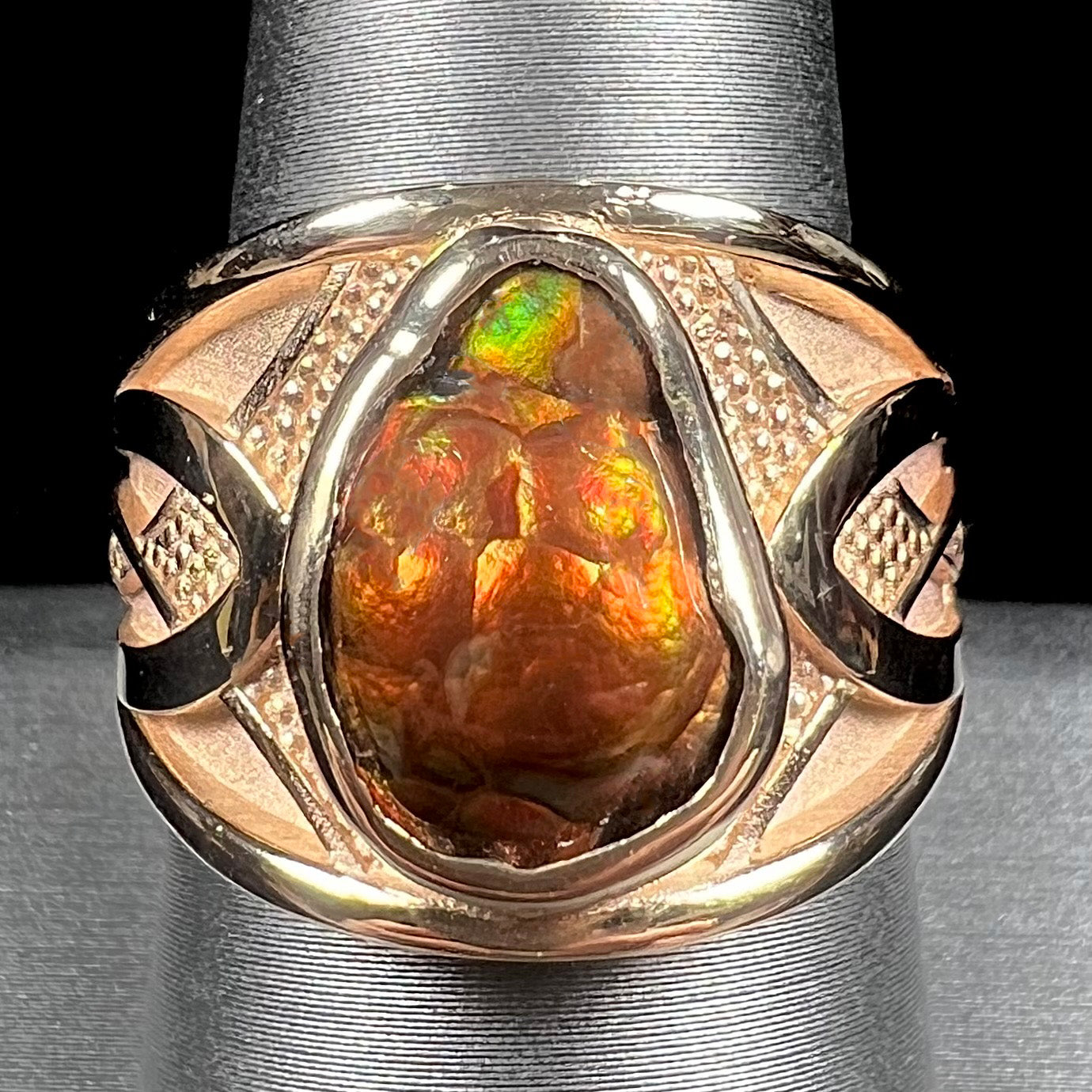 A men's 14kt yellow gold Mexican fire agate ring.