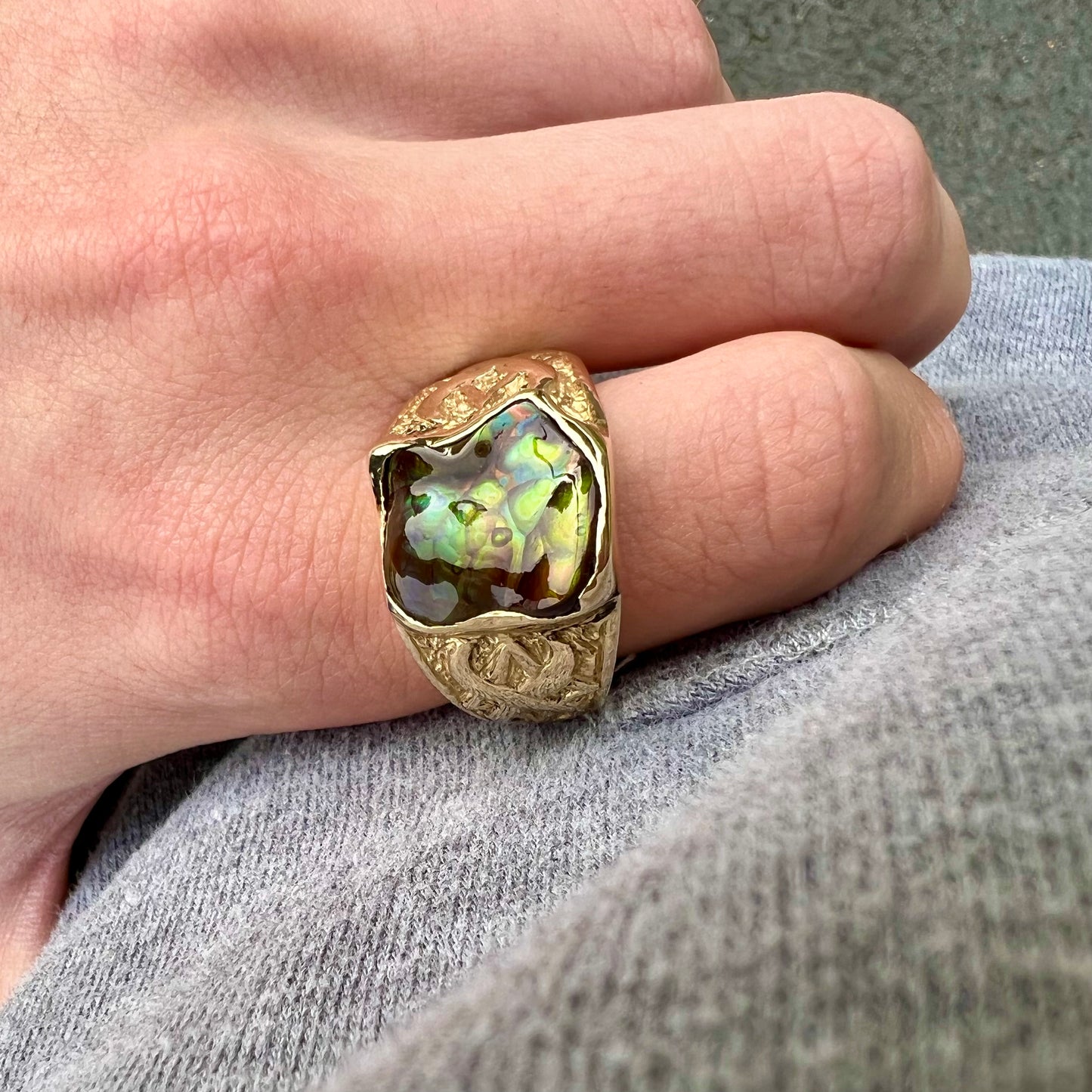Custom, heavy yellow gold men's ring set with fire agate from Deer Creek, Arizona.