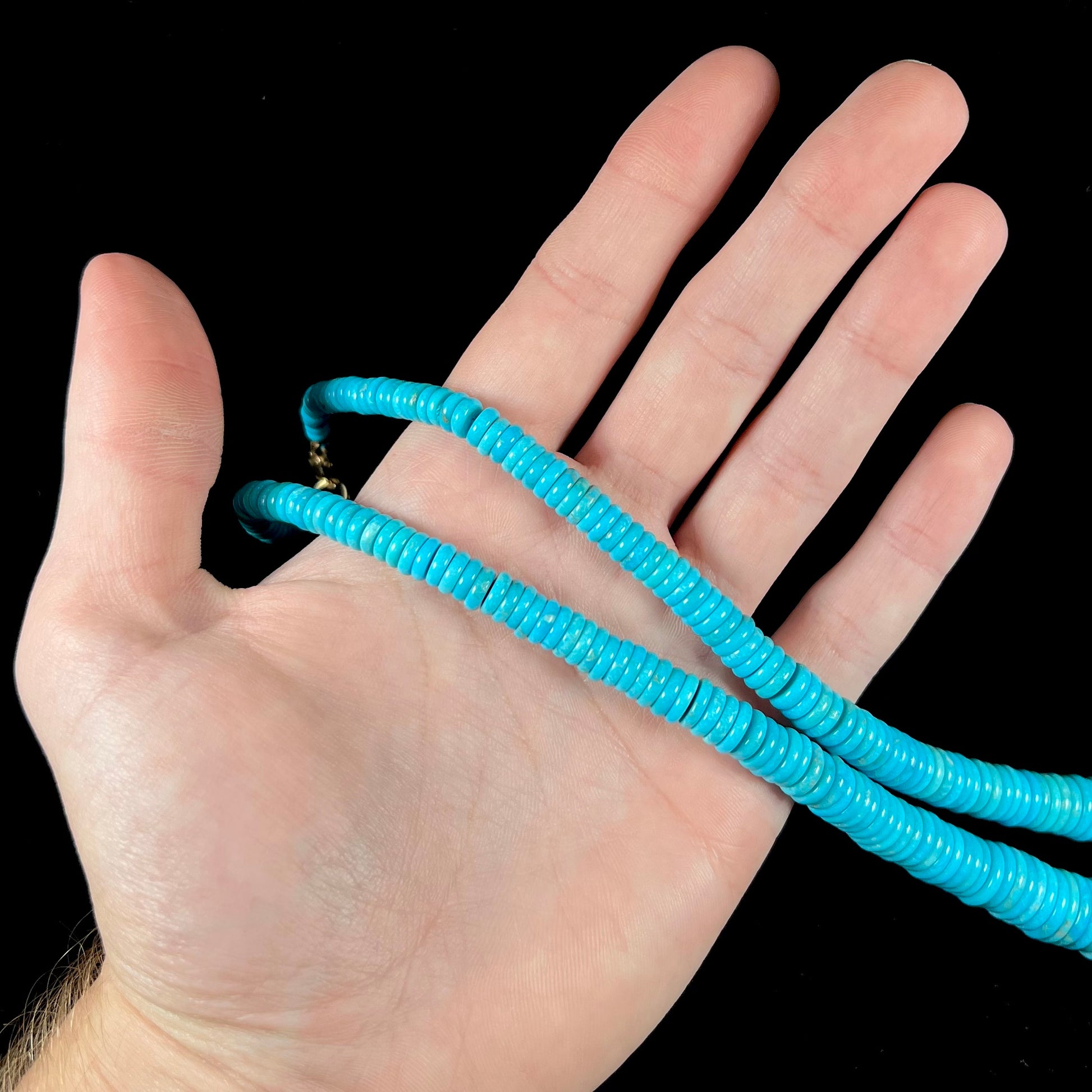 A men's turquoise stone bead necklace made from polished Kingman and Sleeping Beauty Mine turquoise.