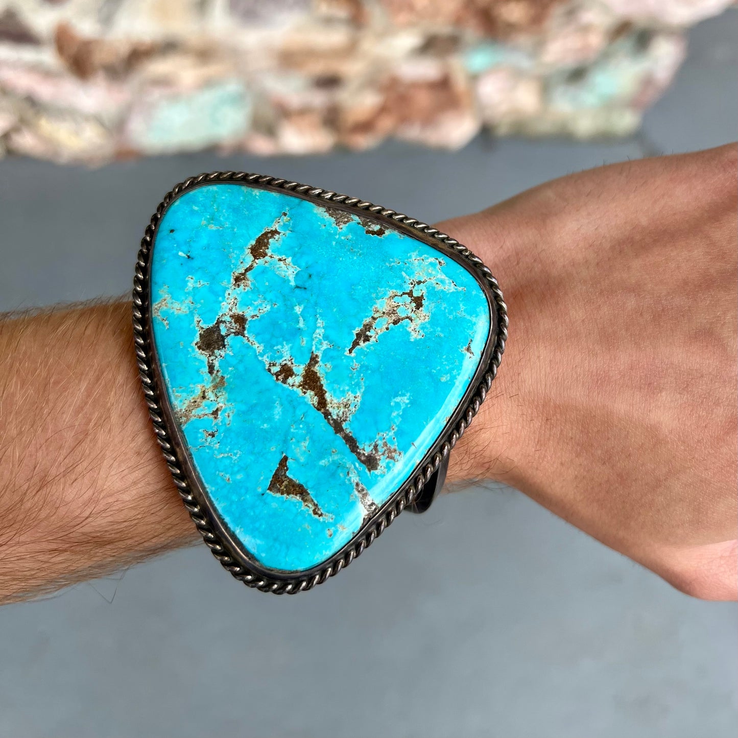 A sterling silver Morenci turquoise cuff bracelet.  The turquoise is large and has orange copper veins.