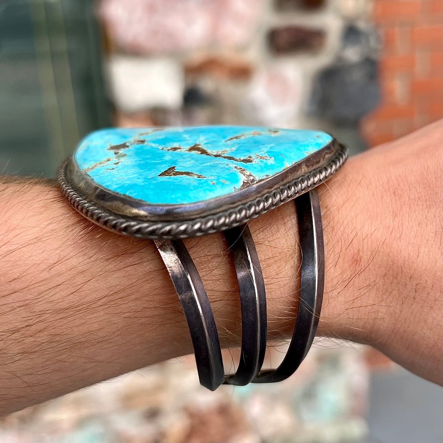 A sterling silver Morenci turquoise cuff bracelet.  The turquoise is large and has orange copper veins.