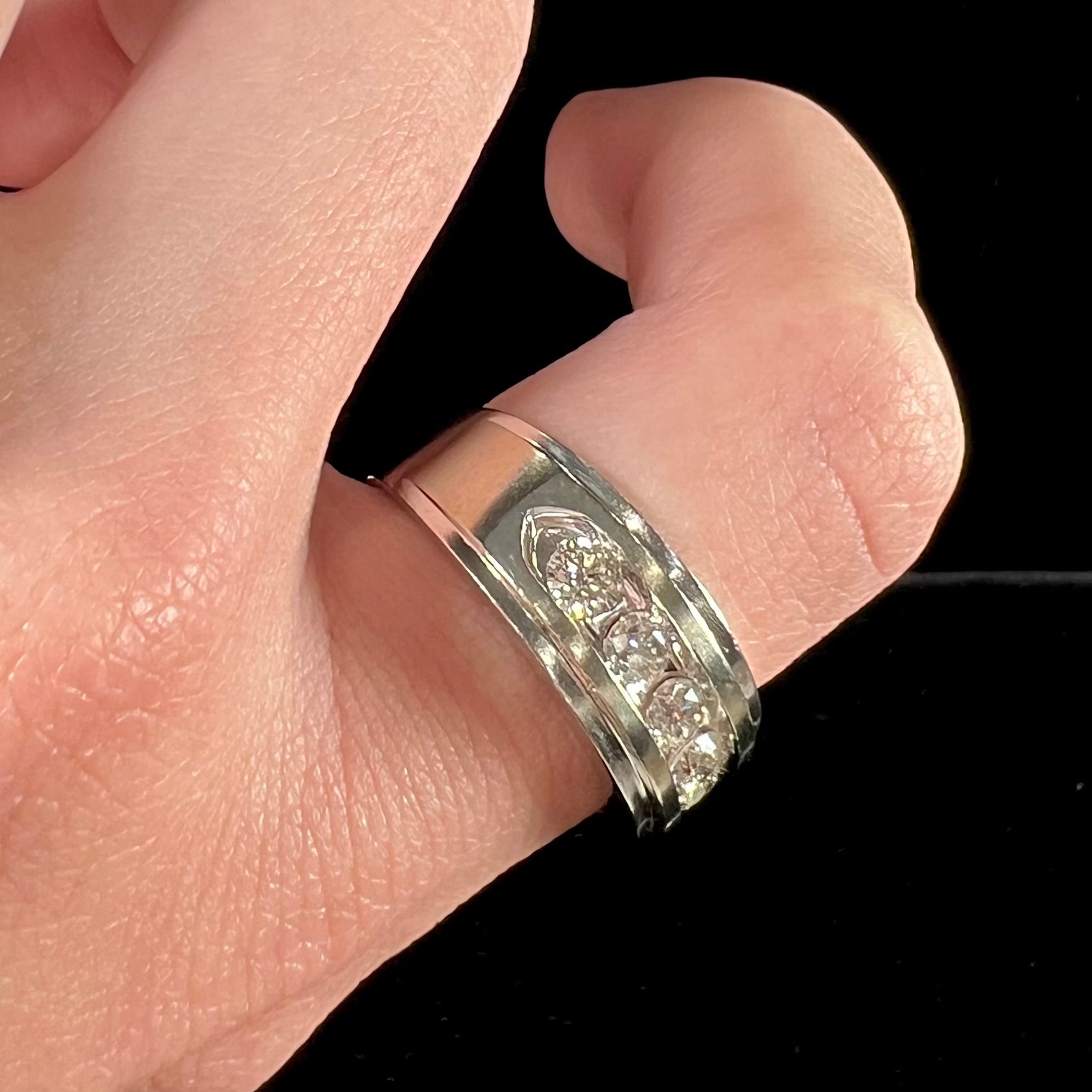 A men's estate white gold five stone diamond ring.