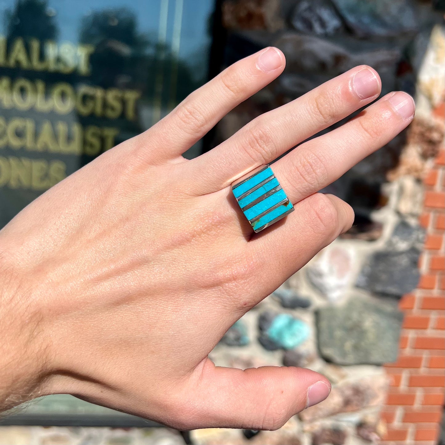 A men's turquoise ring inlay set with four turquoise stones.