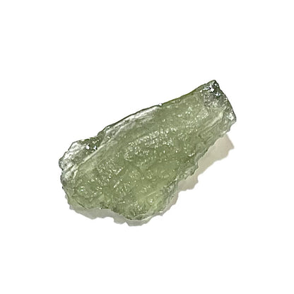 A loose, natural moldavite crystal.