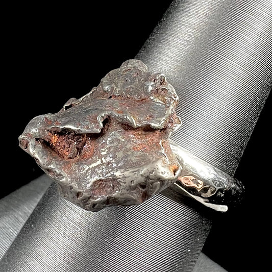 A sterling silver ring set with a Campo del Cielo meteorite.