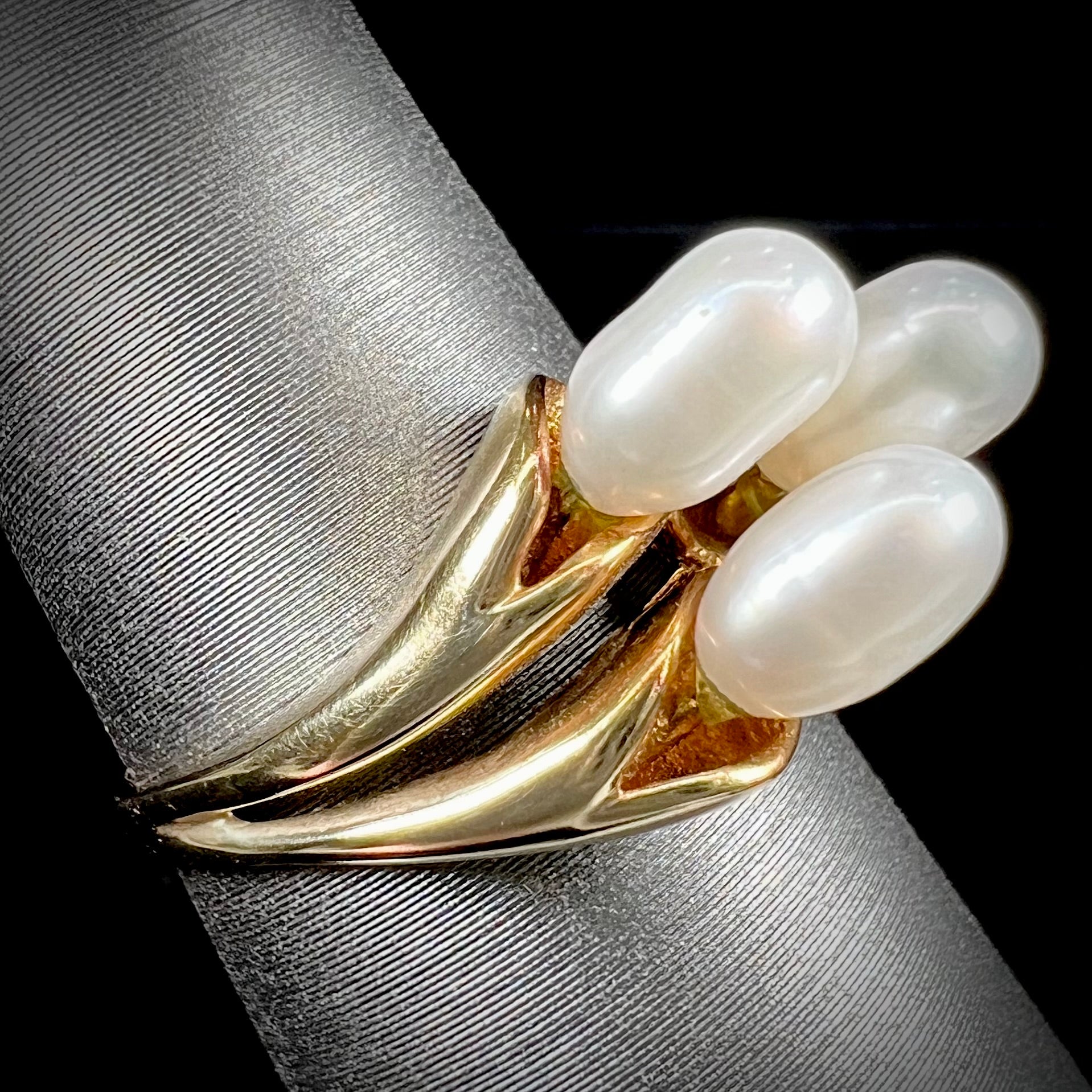 A ladies' vintage, midcentury style freshwater pearl cluster ring in yellow gold.