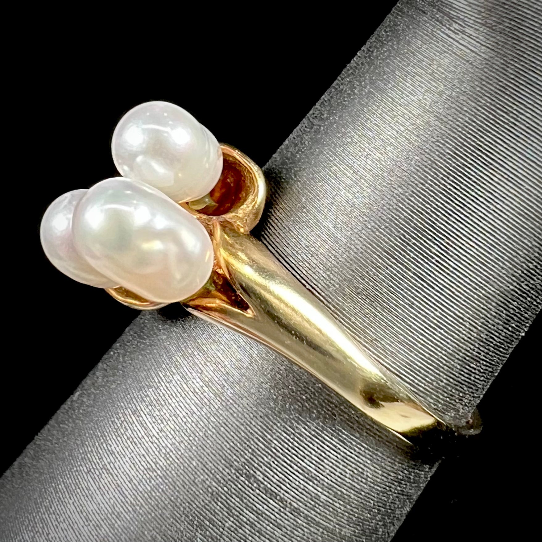 A ladies' vintage, midcentury style freshwater pearl cluster ring in yellow gold.