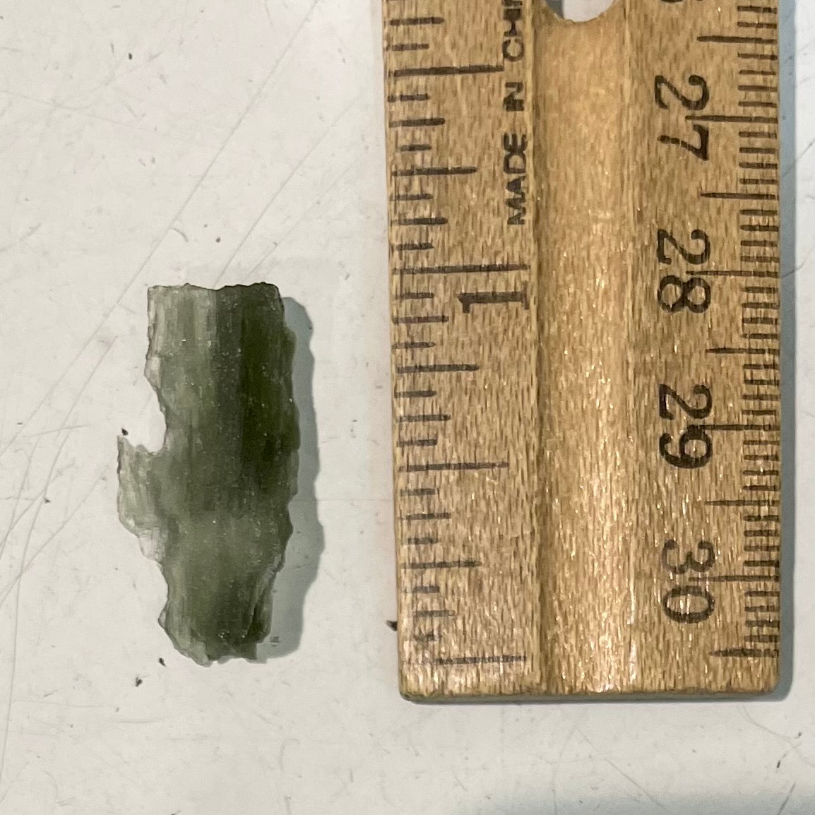 A natural moldavite glass crystal.