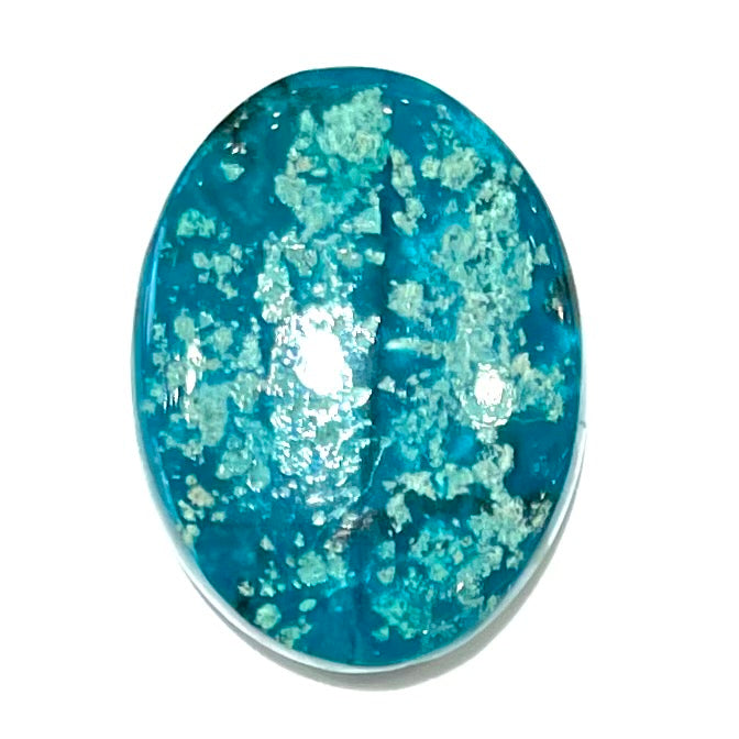 A loose, oval cabochon cut turquoise stone from Morenci, Arizona.  The stone has azurite inclusions.