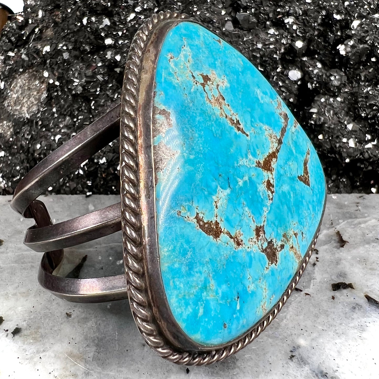 A sterling silver Morenci turquoise cuff bracelet.  The turquoise is large and has orange copper veins.