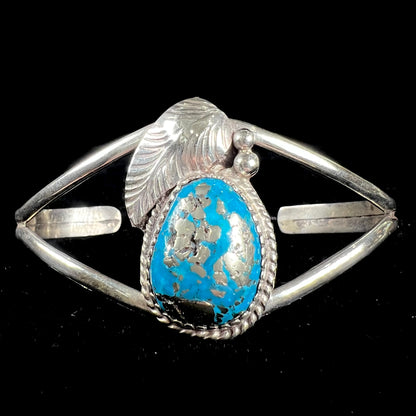 A ladies' silver Navajo cuff bracelet set with a piece of Morenci turquoise stone.