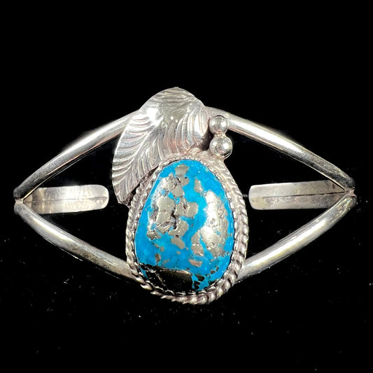 A ladies' silver Navajo cuff bracelet set with a piece of Morenci turquoise stone.