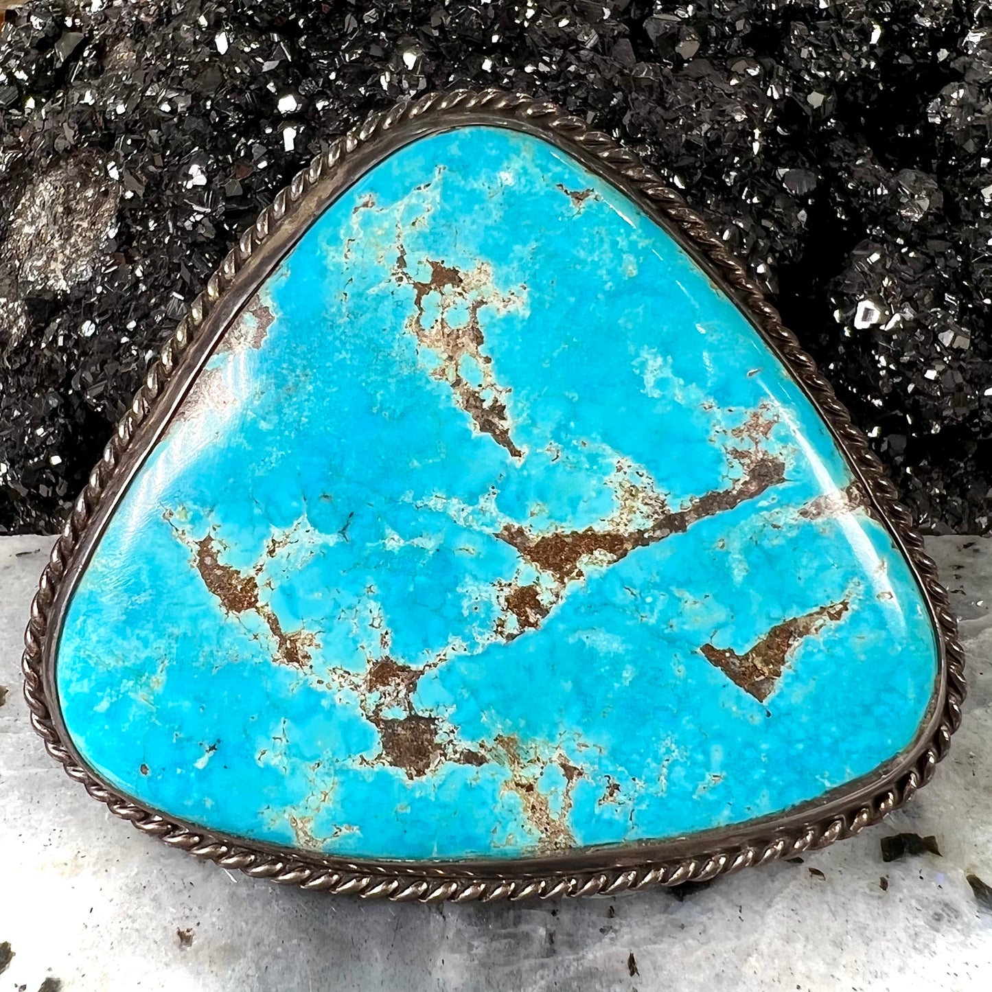 A sterling silver Morenci turquoise cuff bracelet.  The turquoise is large and has orange copper veins.