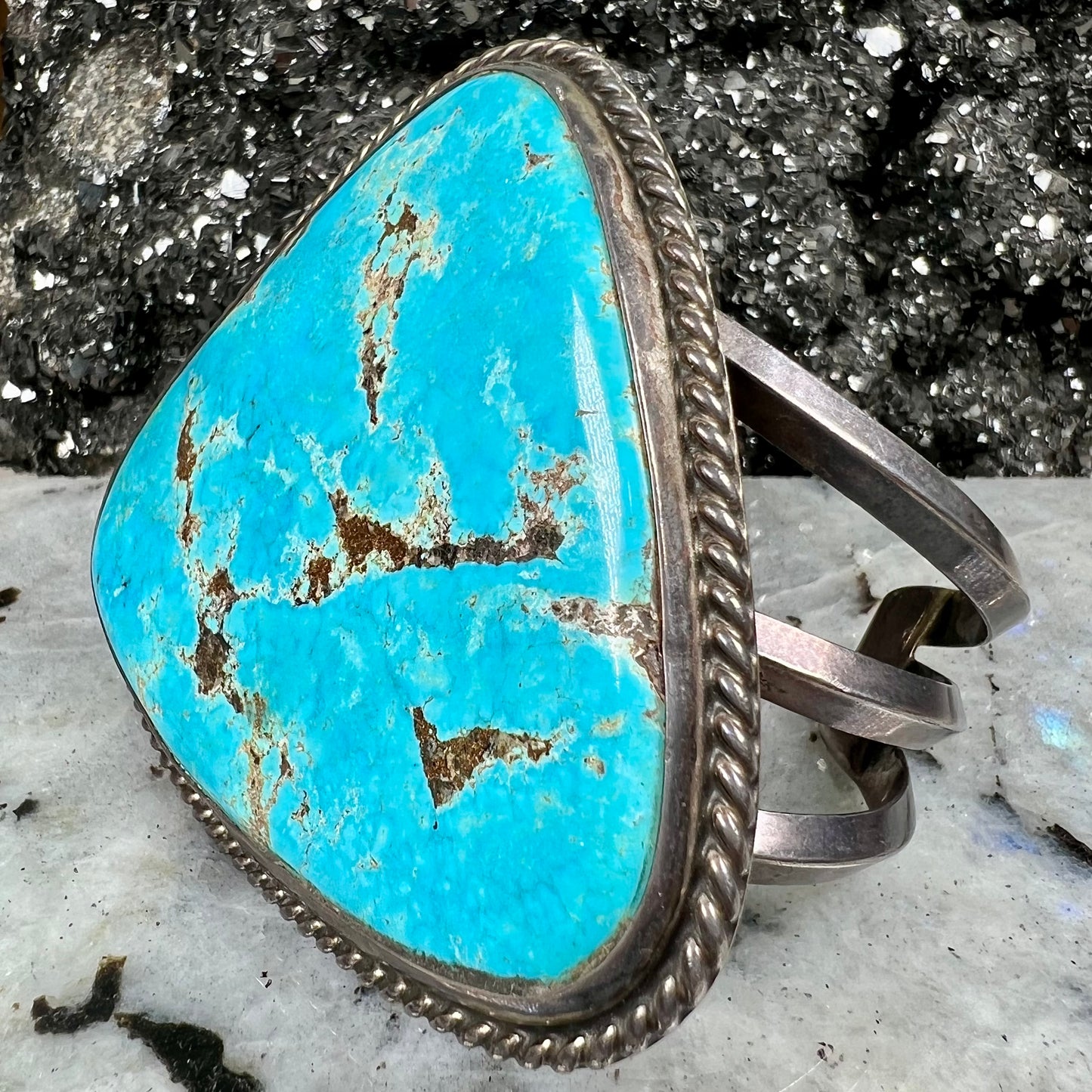 A sterling silver Morenci turquoise cuff bracelet.  The turquoise is large and has orange copper veins.