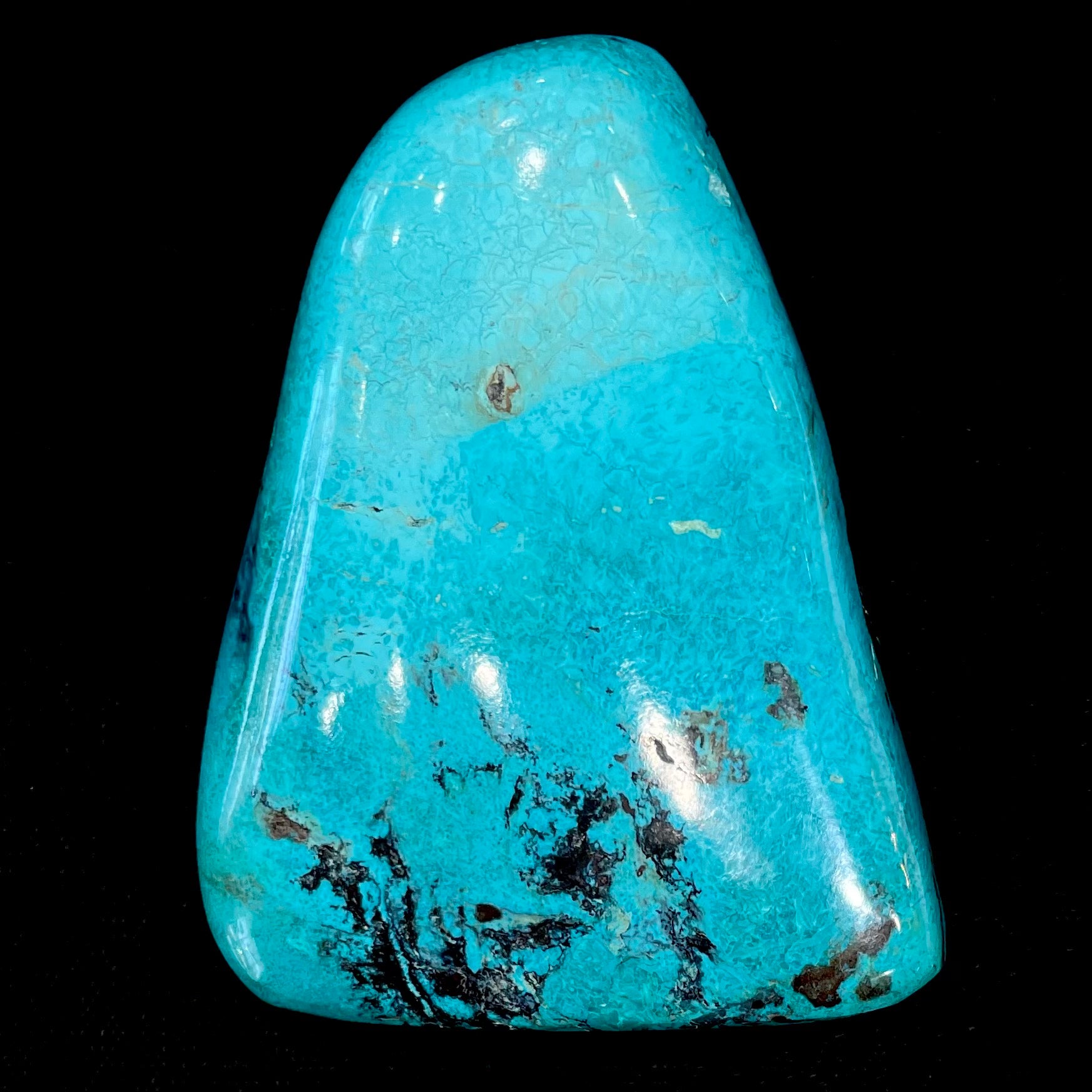 An exceptionally large, freeform shaped, polished turquoise specimen from Morenci, Arizona.