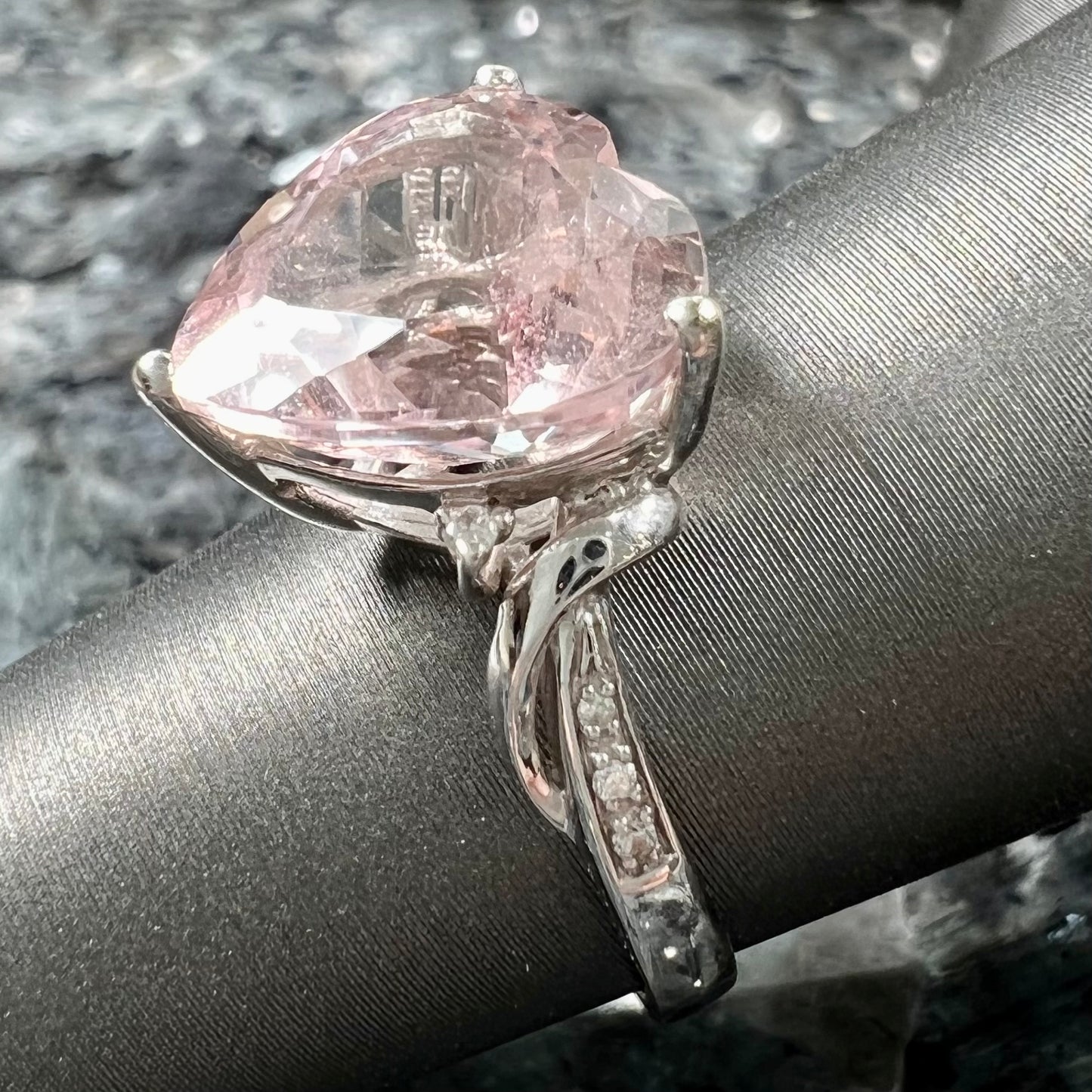 A white gold and diamond heart shaped morganite engagement ring.