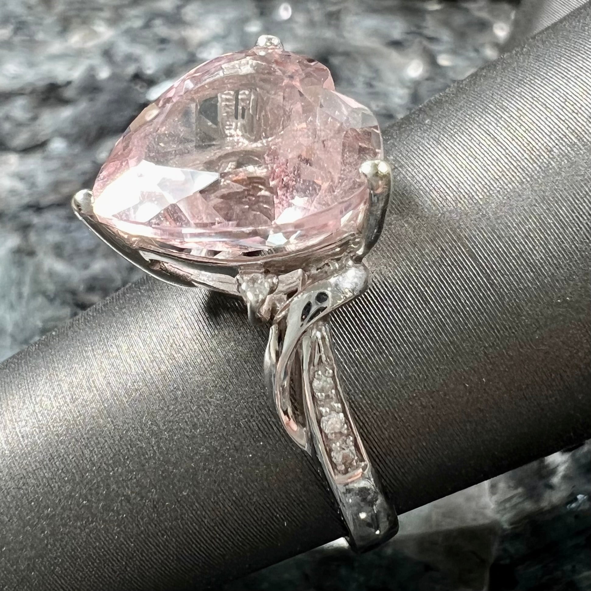 A white gold and diamond heart shaped morganite engagement ring.