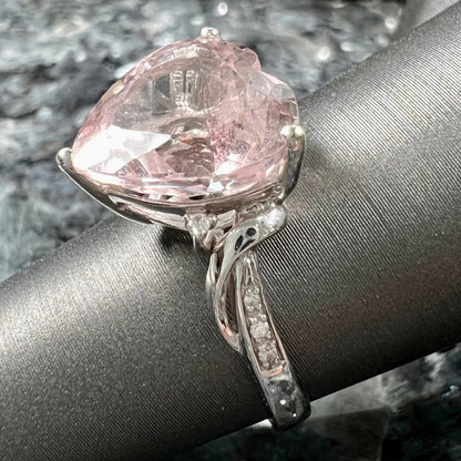 A white gold and diamond heart shaped morganite engagement ring.
