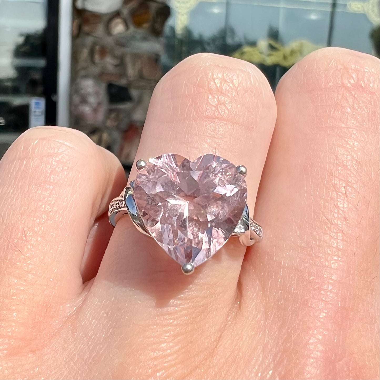 A white gold and diamond heart shaped morganite engagement ring.