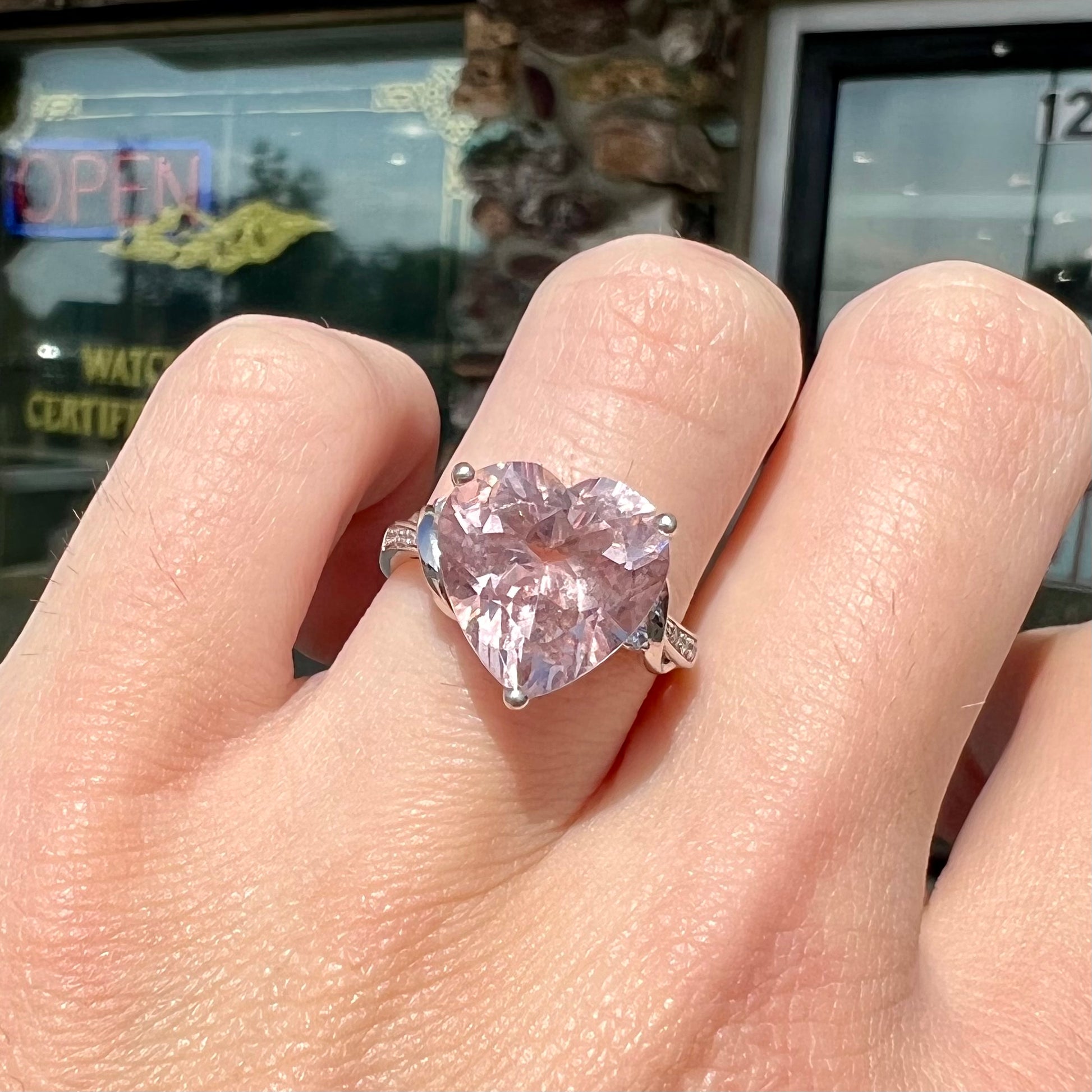 A white gold and diamond heart shaped morganite engagement ring.