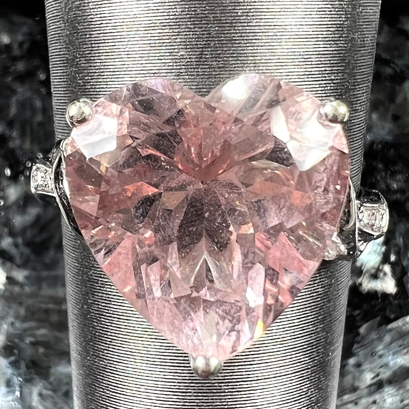 A white gold and diamond heart shaped morganite engagement ring.