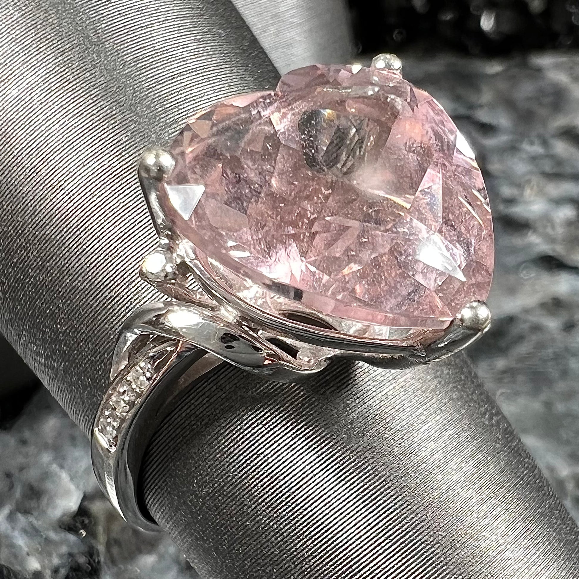 A white gold and diamond heart shaped morganite engagement ring.