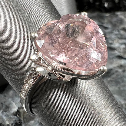 A white gold and diamond heart shaped morganite engagement ring.