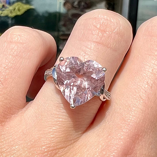 A white gold and diamond heart shaped morganite engagement ring.