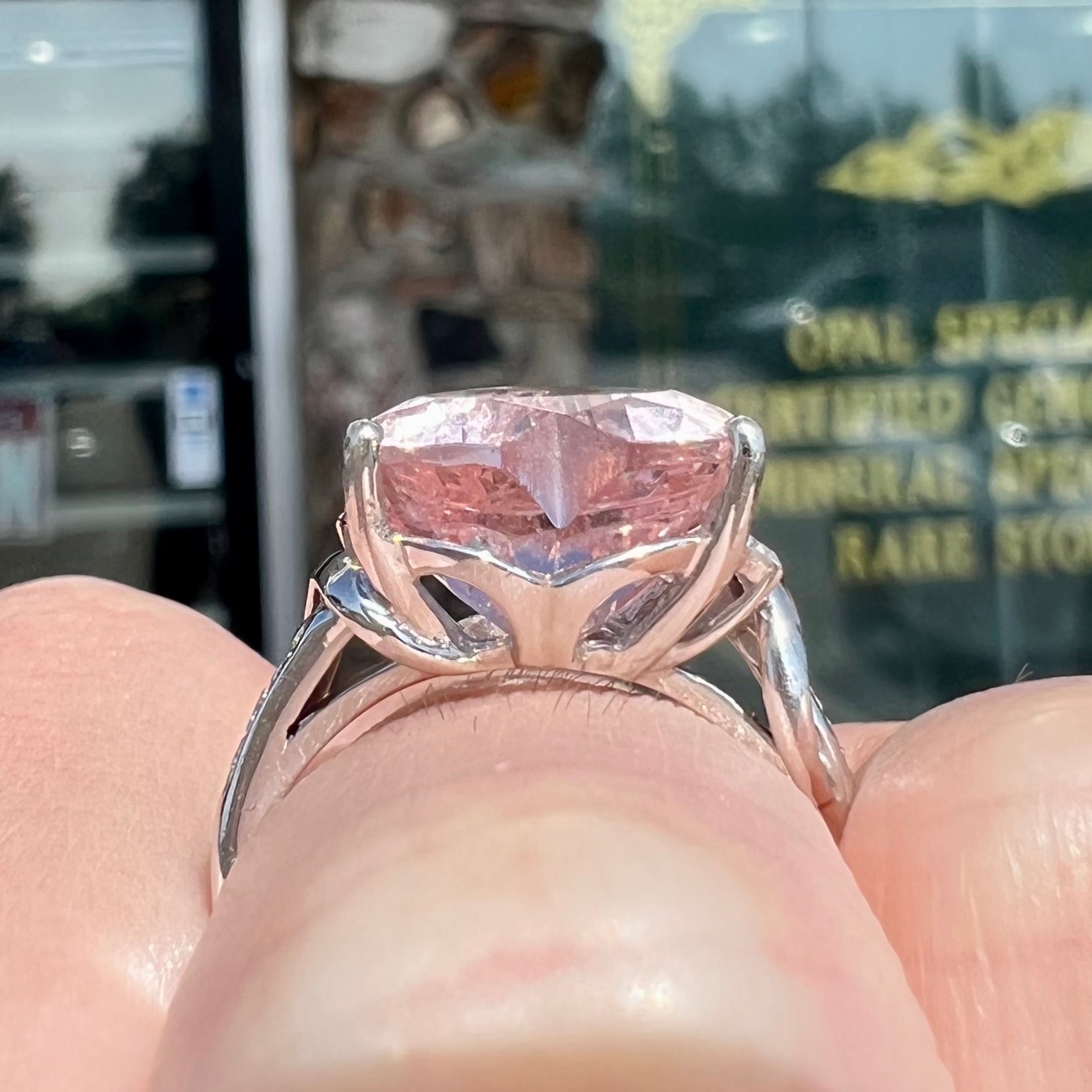 A white gold and diamond heart shaped morganite engagement ring.