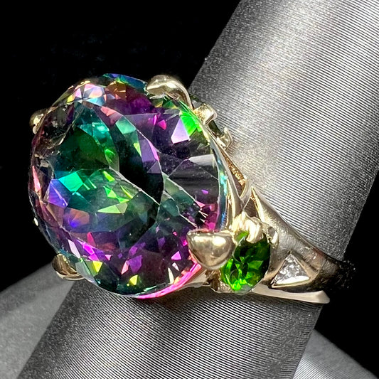 A ladies' large mystic topaz, chrome diopside, and diamond statement ring cast in 14k yellow gold.