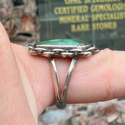 A handmade, split shank, sterling silver ring bezel set with a green variscite stone from Utah, USA.
