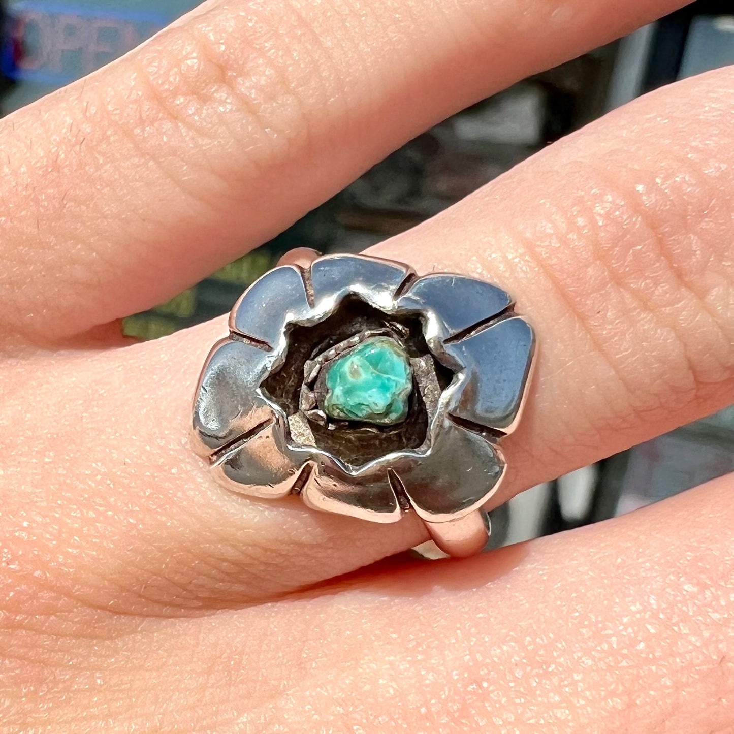 A handmade, sterling silver Native American turquoise nugget ring.