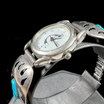 A watch set with two turquoise stones handmade by Navajo artists Arnold and Carleena Goodluck.