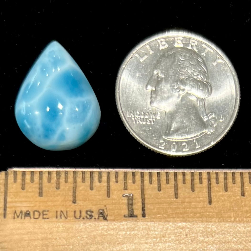 A cabochon cut, pear shaped, natural larimar stone from Dominican Republic.