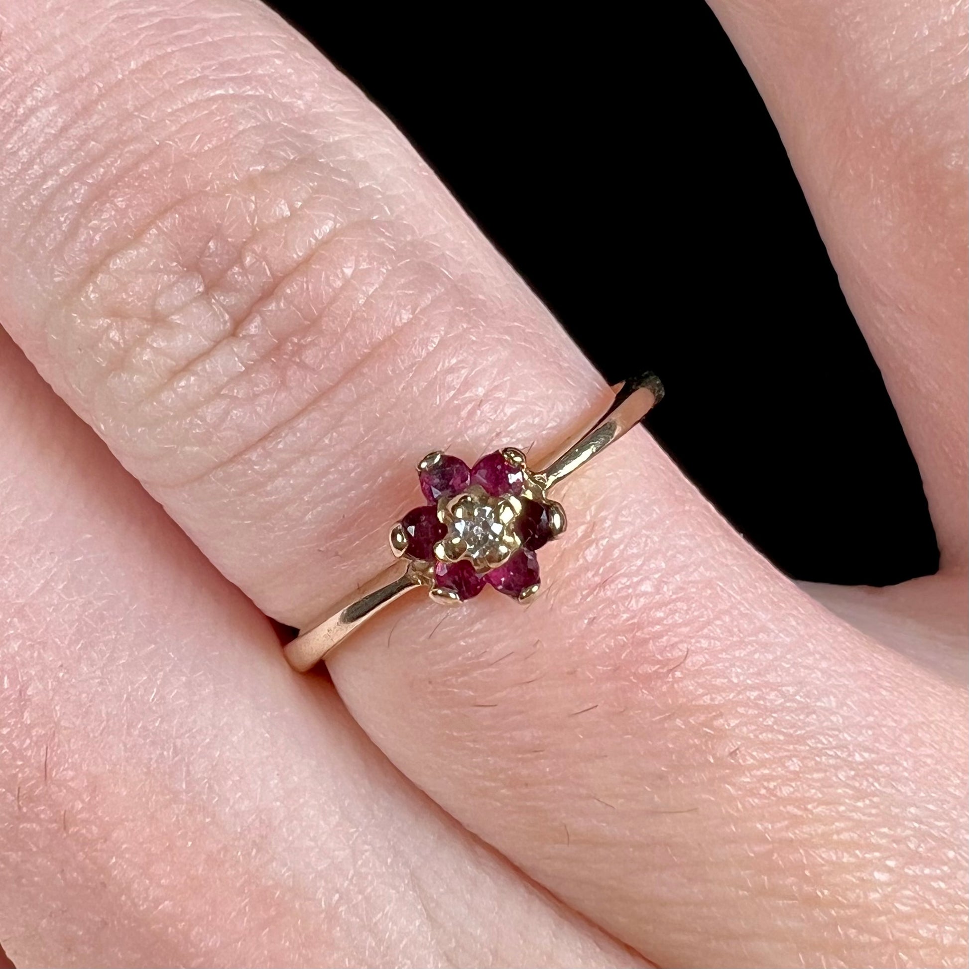 A ladies' estate yellow gold ruby and diamond cluster ring.