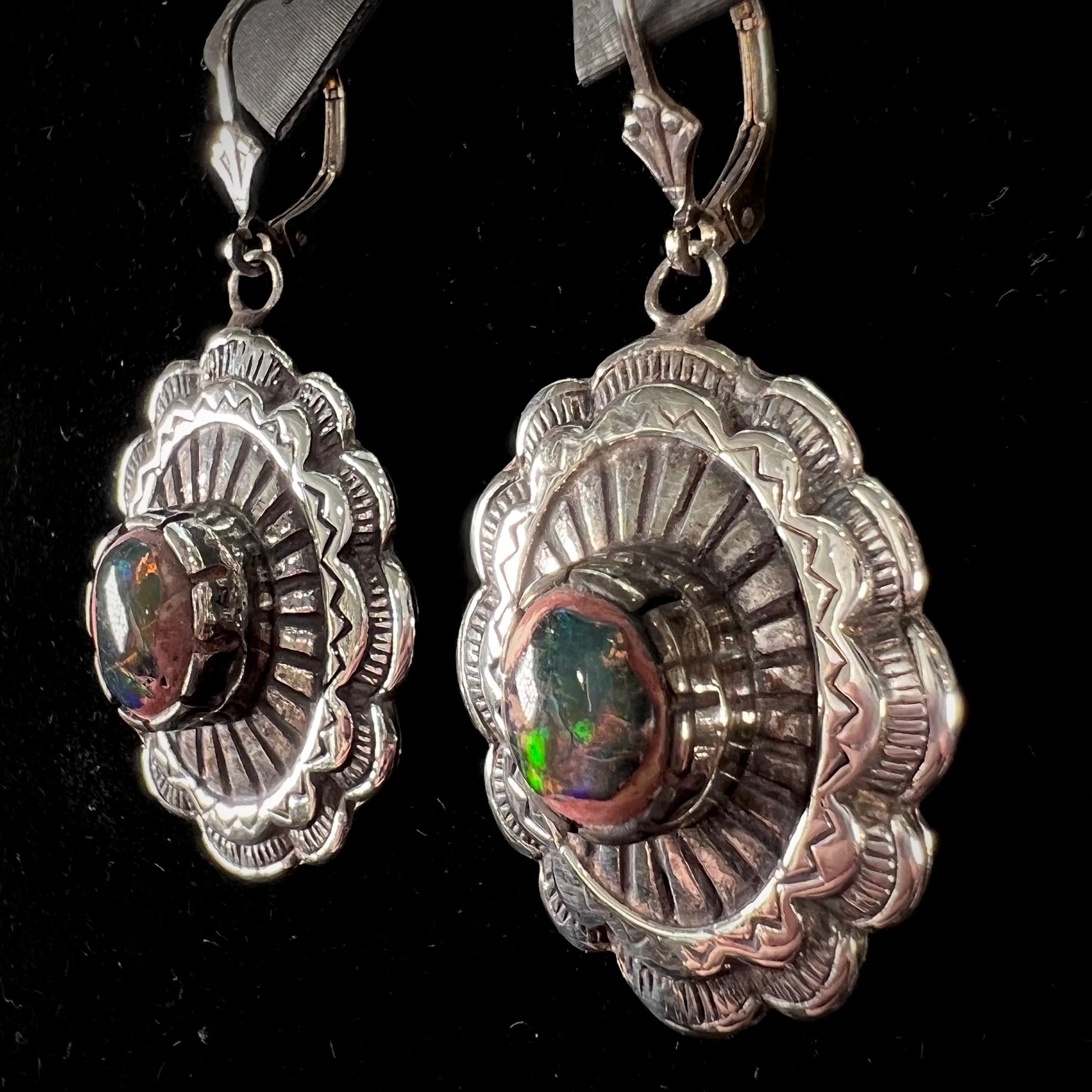 A pair of handmade sterling silver cantera opal earrings.  The earrings are Navajo style by artist Sam Yah.