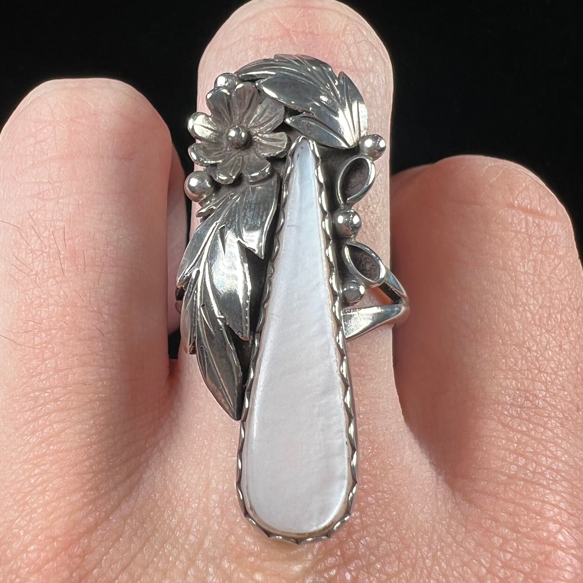 A sterling silver mother of pearl drop ring handmade in Navajo style, signed "MORNINGSTAR."