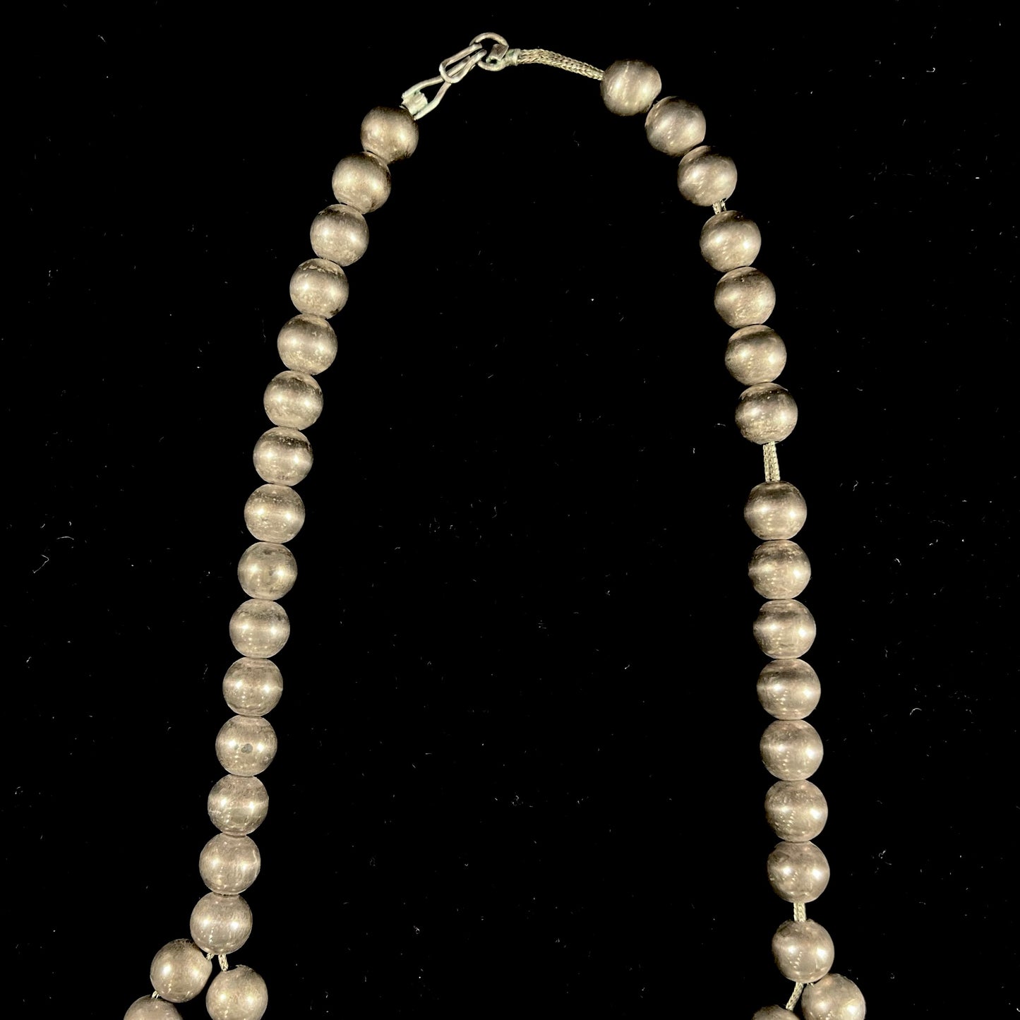 A silver Navajo men's squash blossom necklace set with Fox turquoise and Sonora turquoise.