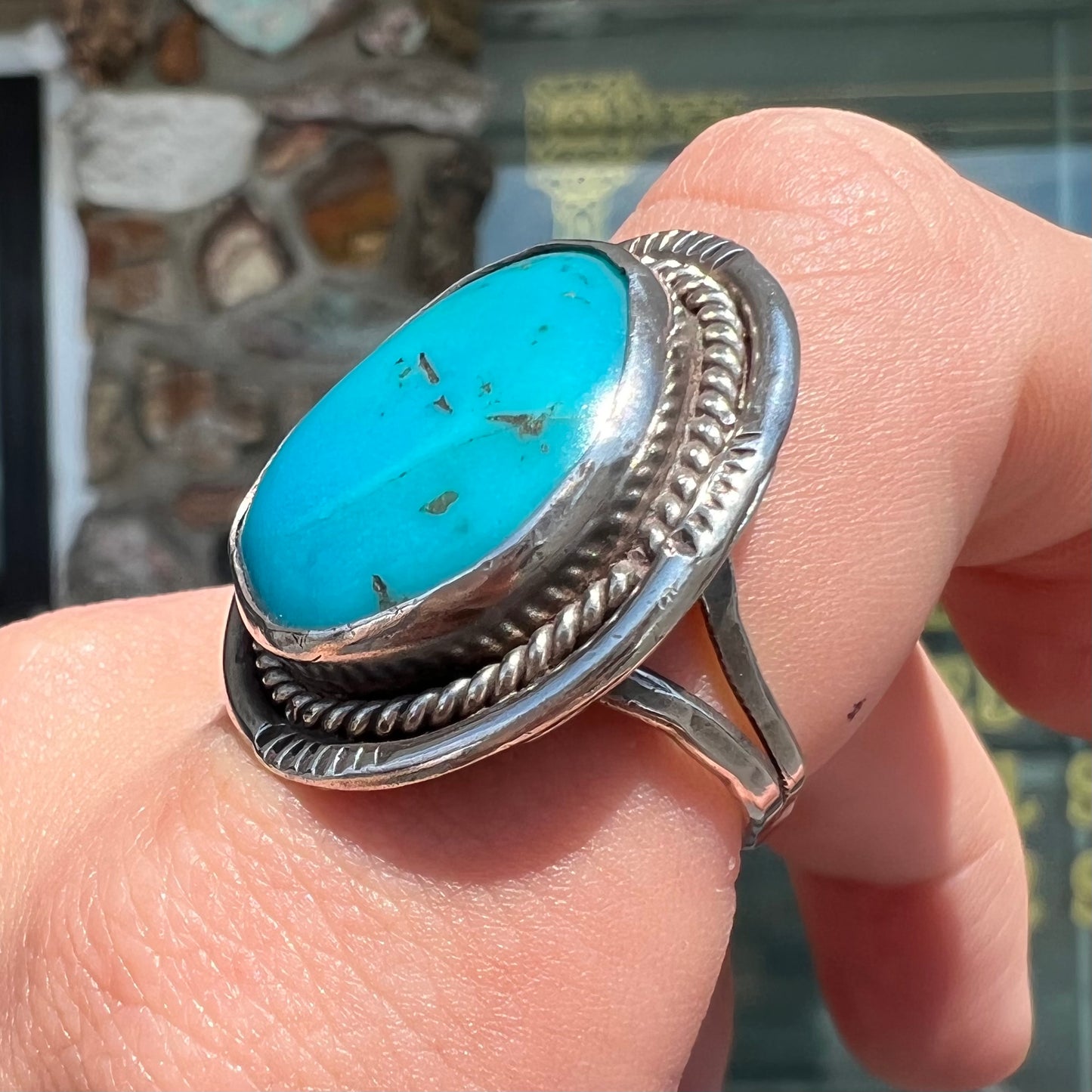 A men's silver, handmade, Navajo turquoise ring.