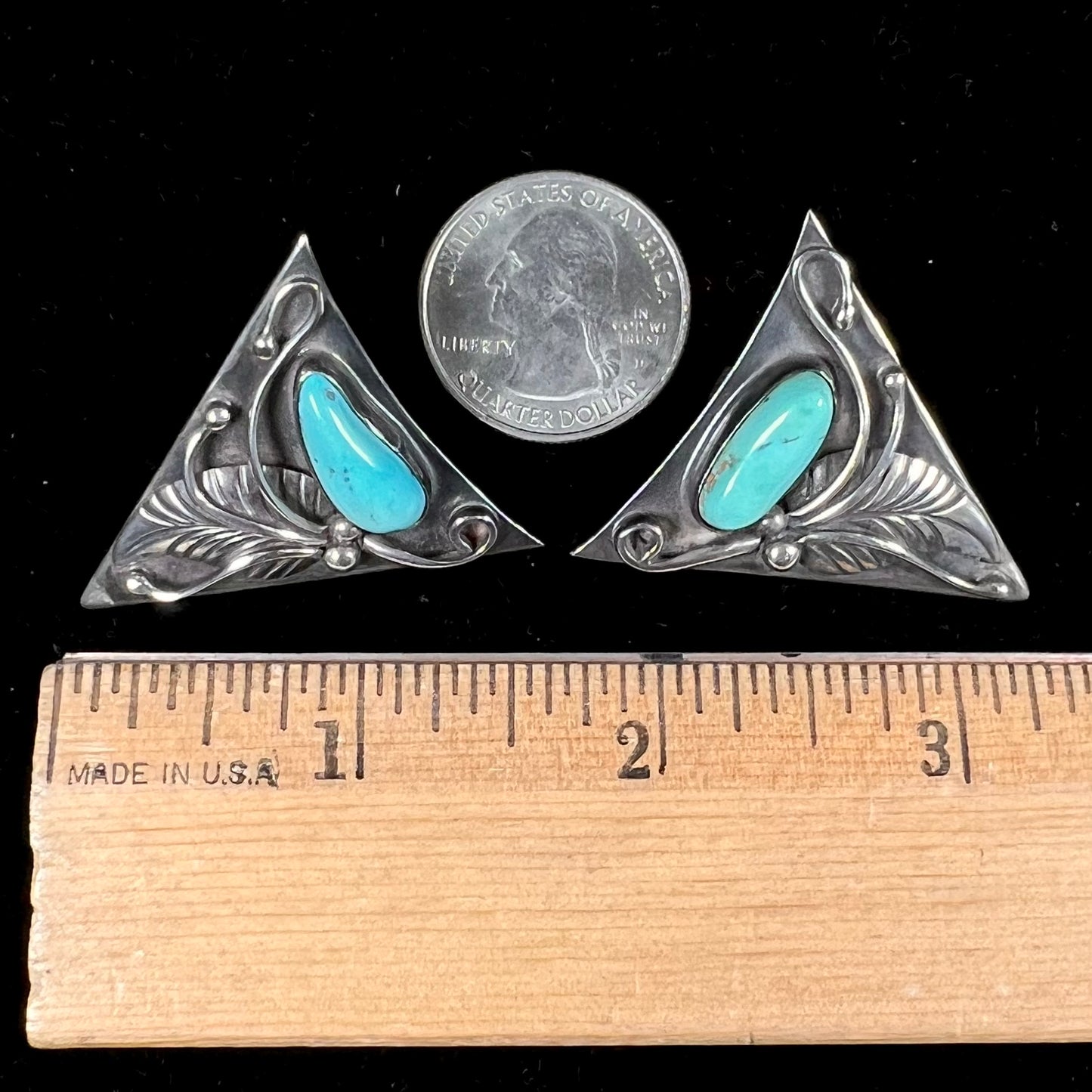 A pair of sterling silver and turquoise shirt collar tips handmade by Navajo artist, Phillip Guerro.